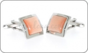Embossed frame cufflinks with an orange cat's eye