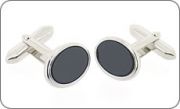 Small oval cufflinks with a black core