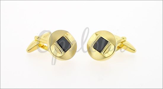 Gilded oval cufflinks with a black core