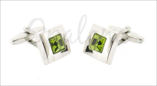 Square cufflinks with a green crystal