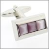 Three purple cat's eye stones