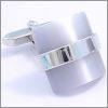 Curved light grey cat's eye cufflinks with a silver ring