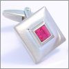 Square cufflinks inlaid with a red crystal