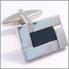 Cufflinks with a banded frame and a black core