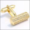 Cylindre dor� serti de cristaux de Swarovski blancs