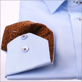 Chemise bleue à col et poignets à motifs fleuris marrons