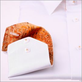 White shirt with brown and orange patterns collar and cuffs
