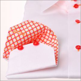 White shirt with orange and pink geometric pattern collar and cuffs