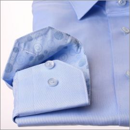 Light blue shirt with blue circular pattern collar and cuffs