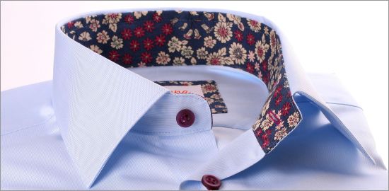 Light blue shirt with beige and purple flower collar and cuffs