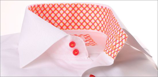 White shirt with orange and pink geometric pattern collar and cuffs