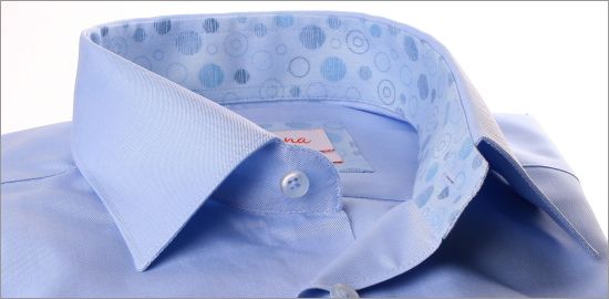 Light blue shirt with blue circular pattern collar and cuffs