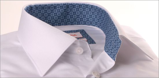 White shirt with blue floral collar and cuffs