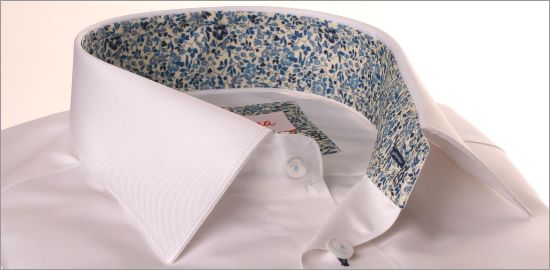 White shirt with navy floral collar and cuffs