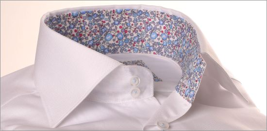 White shirt with blue floral collar and cuffs