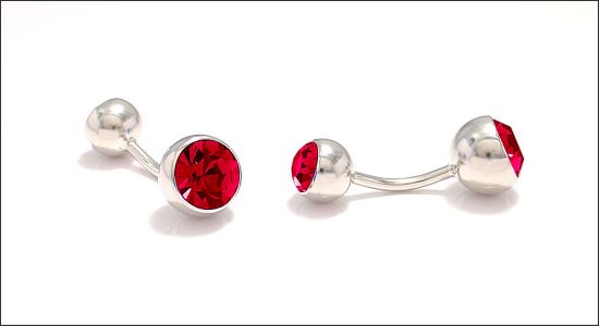 Bouton de manchette boule incrustée d'un cristal rouge